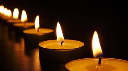 row of candles burning in a dark room symbolize. concept hope and faith for designer . 