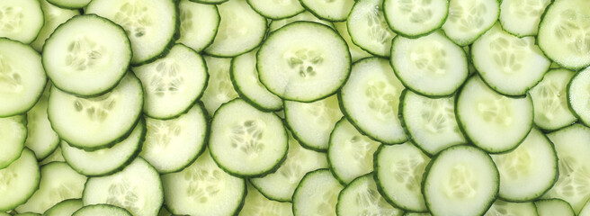 Cucumber slices panorama on white background isolated