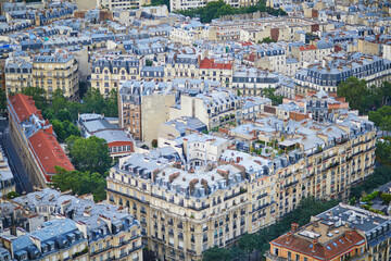Obraz premium Aerial view of the city roofs in Paris, France.
