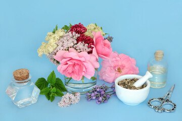 Calming naturopathic flowers and herbs with mint, valerian root, rose, elder, passion and lavender flowers used in natural herbal medicine. Adaptogen tranquilizing food ingredients on blue.