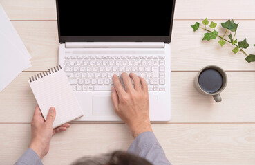 man's desk work seen from above.  上から見た男性のデスクワーク