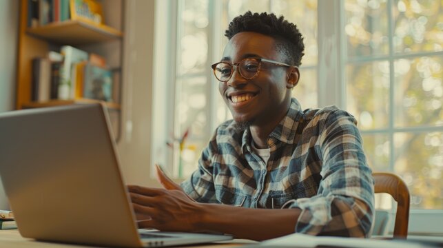 With glasses and happiness, man, laptop, and smile for home office remote work, research, or copywriting. Computer, employee, and online project reader or worker