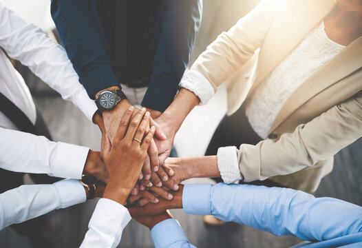 Group, business people and hands in stack for team building, collaboration or circle in workplace community. Crowd, above or solidarity at company office for staff commitment, together for support