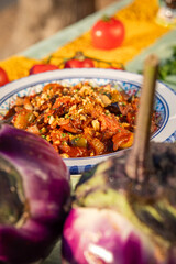 caponata is a Sicilian dish consisting of chopped fried eggplant aubergine and other vegetables, seasoned with olive oil, tomato sauce