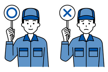 ○×マークを上げるつなぎ作業服の男性