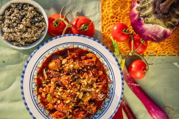 caponata is a Sicilian dish consisting of chopped fried eggplant aubergine and other vegetables, seasoned with olive oil, tomato sauce