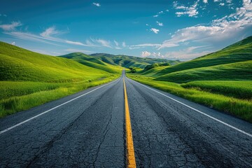 The asphalt road leading to the distance on the grassland