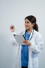 professional medical specialist in a white coat holding tablet, isolated on white background.