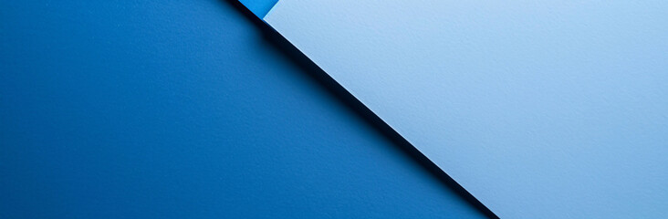 Minimalist blue background with a geometric shape resembling a piece of paper