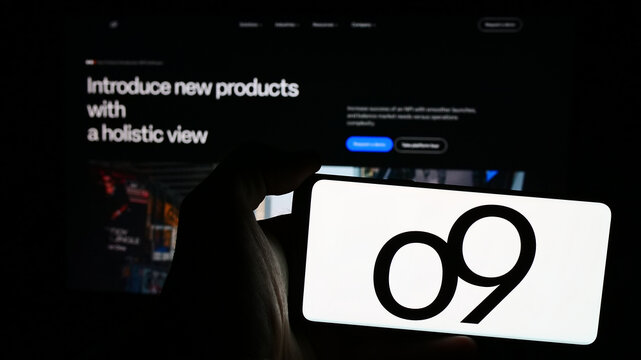 Stuttgart, Germany - 06-01-2024: Person holding mobile phone with logo of American analytics software company o9 Solutions Inc. in front of web page. Focus on phone display.