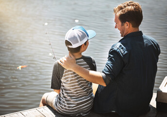 Happy father, back and teaching son with fishing rod by lake, ocean or beach together in nature....