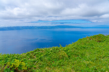 surrounding area with strong vegetation in the Pico da Esperança area, São Jorge Island-Azores-Portugal. surrounding area with strong vegetation in the Pico da Esperança area, the highest point 