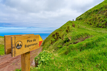 wooden arrow sign indicating direction along the trail to Pico da Esperança. São Jorge Island-Azores-Portugal. wooden arrow sign indicating direction along the trail to Pico da Esperança