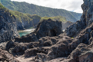 large black rock formations of volcanic origin in the area surrounding the Simão dias pool. São...