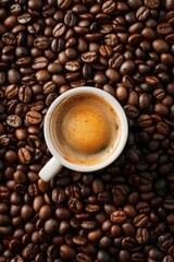 Fototapeta premium Coffee Cup on Coffee Bean Pile