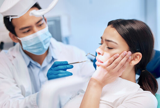 Dental, fear or woman with toothache in dentist consultation for mouth examination, gingivitis or bacteria. Tooth extraction, pain or cosmetic surgeon with tools for cavity, root canal or procedure