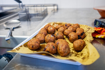 fried meatballs in a restaurant kitchen 