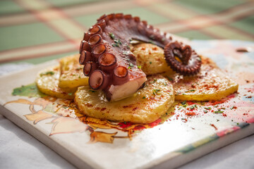 Polbo á feira, alternatively known as pulpo estilo feira, is a traditional Galician dish