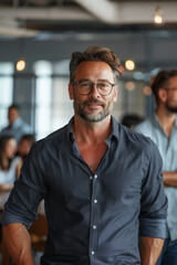Obraz premium Businessman leading team in modern office, inspiring confidence and collaboration.