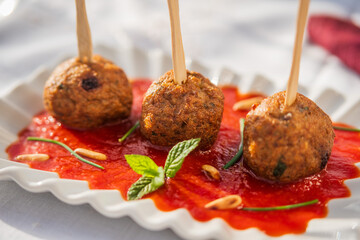 meatball on tomato source served at restaurant 