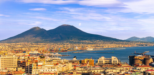 Obraz premium urban view on a Naples city with houses buildings and mount Vesuveus with amazing cloudy sky on background of landscape