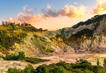 landscape of Plegrean volcano fields in Naples Italy near Pompeii with sulfur yellow caldera duribg eruption of smoke. campi Flegrei and cataclysm of Earthquake
