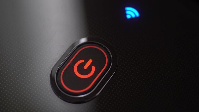 Closeup shot of a blinking red power button