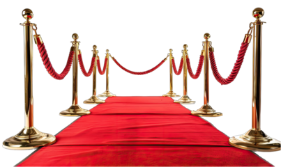 Red carpet is leading to a line of golden stanchions, suggesting a prestigious event, a movie premiere, or an exclusive celebration