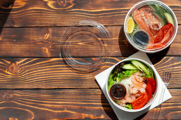 Take out poke bowl on wooden background