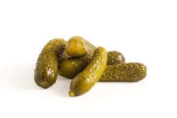 pile of cucumber dill pickle, spears, chips and whole isolated on white background, flat lay
