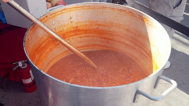 Cooking Manhattan Clam Chowder in a Large Casserole - Close Up
