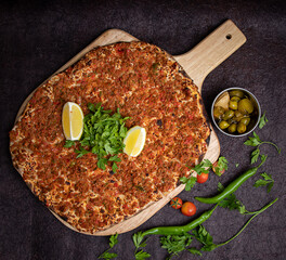 Lahm bi ajeen pizza bread served in wooden board isolated on background top view of Arabic Manaqeesh