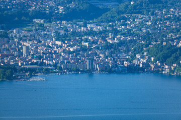 Obraz premium The mountains and the landscape of lake Lugano, during a spring day, near the town of Brusino Arsizio, Switzerland - May 25, 2024.