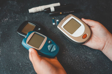 Instruments for measuring blood sugar top view on black background