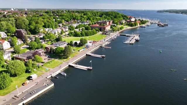 Aerial view of Kiel Harbor's inner fjord, the Schleswig-Holstein Landtag building, the Kiellinie promenade and  jetties. Aerial footage of Kiel inner Fjord, Kiel bay.