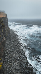 Majestic cliffs along the west coast in Latrabjarg Iceland during stormy weather and high waves