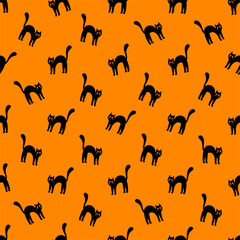 Black cat seamless pattern. Cute Halloween print with angry cats on orange background.