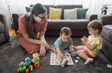 Mom playing with her two kids