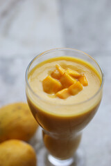 Isolated mango collection. Thai yellow mango fruits of different shapes, pieces and leaves isolated on marbel background Photo alphonso mango or hapoos aam is a seasonal and juicy fruit from india 