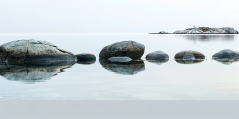 coastal Sweden, archipelago, rounded worn stones peeking out of gentle coastal water, feeling coldness, yet serene and pretty, award winning photography 