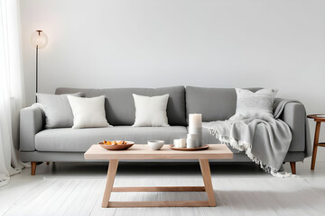 Comfortable grey sofa with cushions, blanket and table on white background. Furniture for living room interior