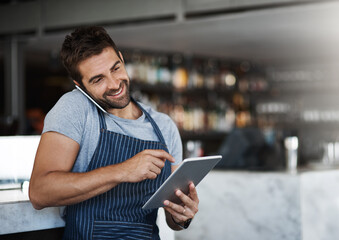 Man, waiter and phone call with tablet for online service, booking or order on table reservation at cafe. Happy male person or barista talking on mobile smartphone or technology at indoor restaurant