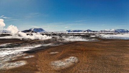 Impressive geothermal area Hverir Island with its smoke columns, red Mars-like soil and moon-like craters