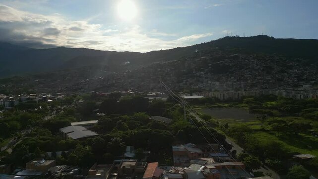 Aerial View of El Lido Siloe Neighborhoods, Cali Colombia. Dolly Forward Shot with Cable Cars Below