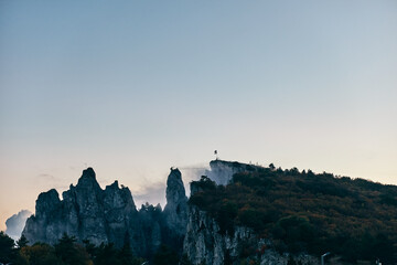 Obraz premium Scenic Mountain View with Church in the Background, Serene Landscape on Top of Hill, Travel Destination with Religious Architecture and Stunning Nature