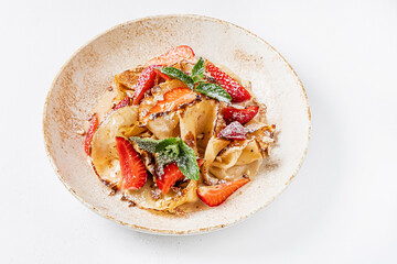 pancakes with fresh strawberries and banana