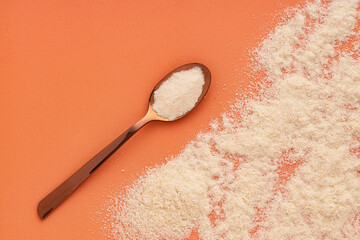 Organic gelatin powder also called hydrolyzed collagen - White powder in spoon