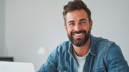 Fototapeta premium Happy businessman man at desk with laptop in office.