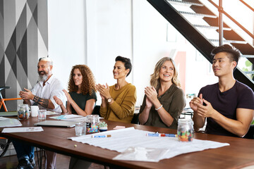 Clapping, business and group in meeting, together and smile for success of collaboration and deal. Happiness, teamwork and people in sales, applause and celebration in company and paperwork on desk