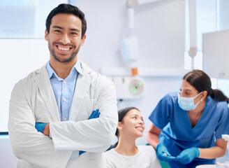 Portrait, dentist and nurse for oral health, dental care and hygiene in office or consultation in clinic. Man, arms crossed and smile as medic or doctor in hospital for treatment of teeth or mouth